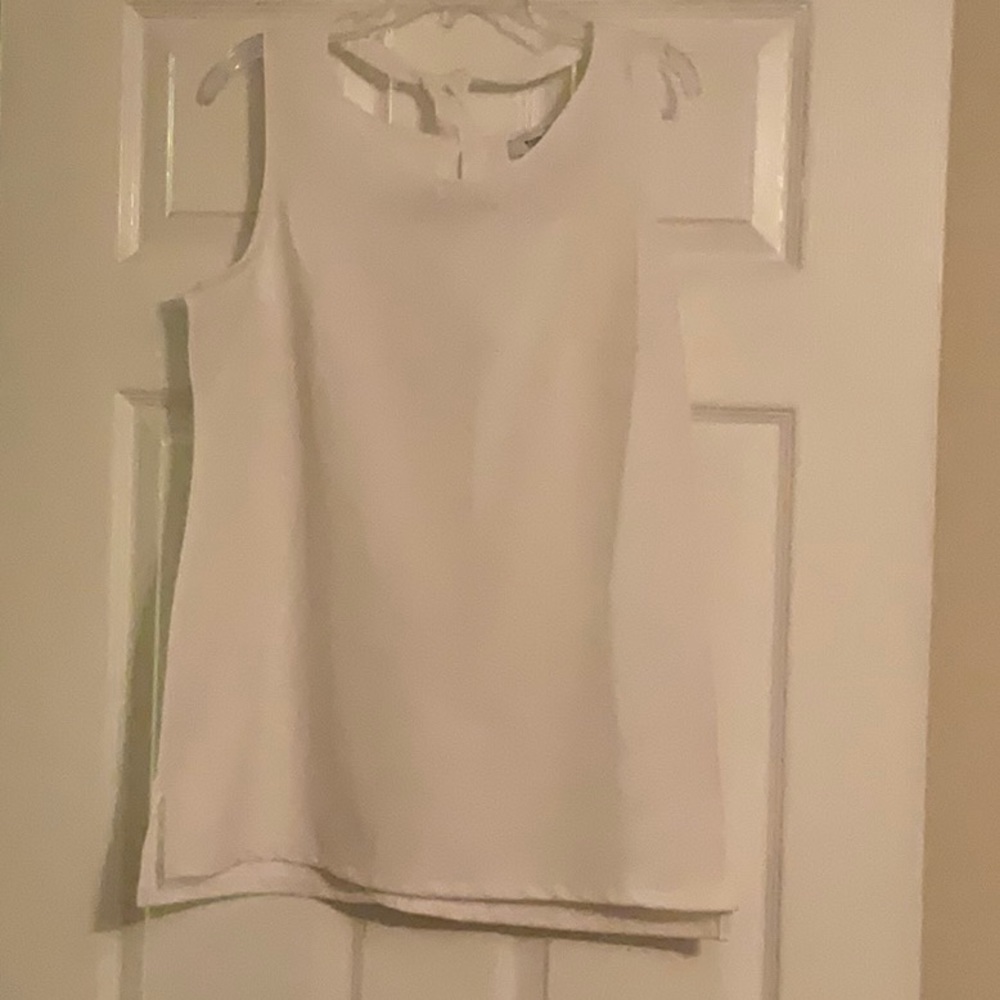 White House Black Market sleeveless white top.